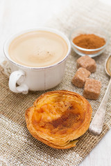 traditional egg tart pastel de nata with cup of coffee