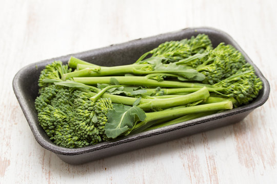greens on dish on wooden background