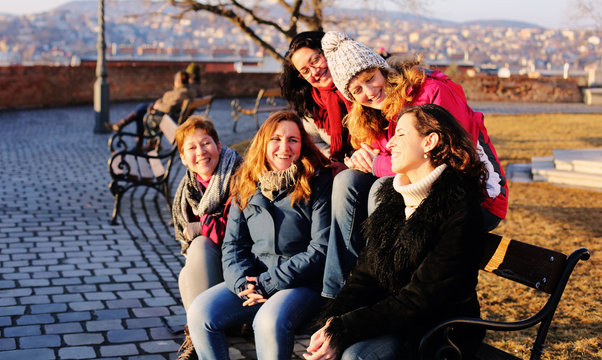 Outdoor portrait of happy woman walking on Budapest