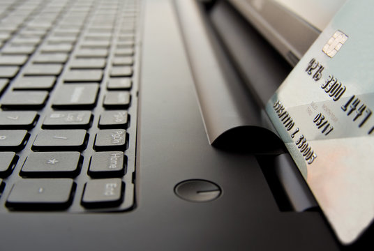 Closeup view of credit cards on laptop keyboard. online shopping