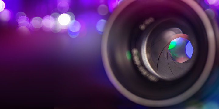 Camera lens with bokeh background.