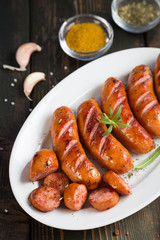 Grilled sausages with spices and beer