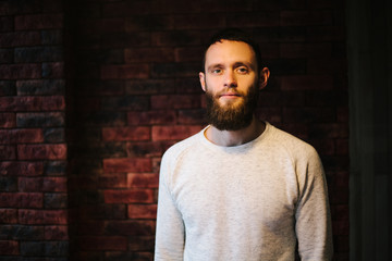 Man with a beard looking ahead