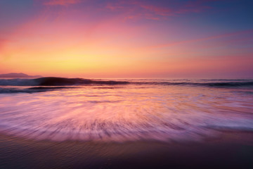 Naklejka na ściany i meble sunset on beach shore