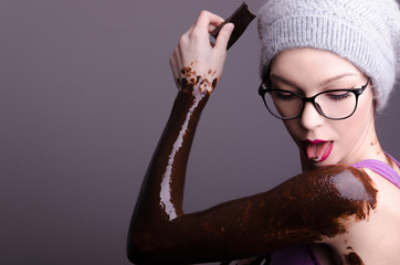beautiful hipster girlfriend or wife dirty with chocolate in the