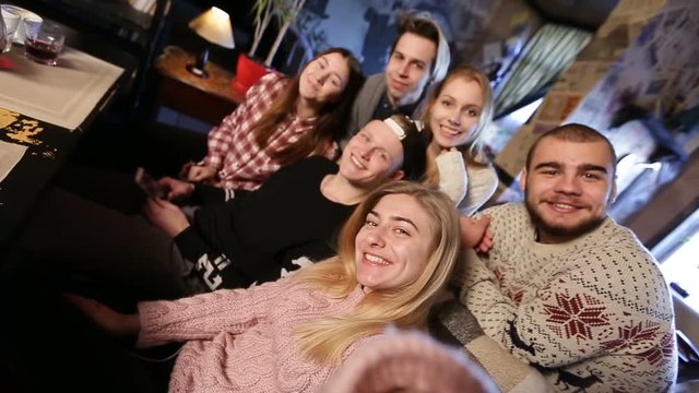 Group of friends taking selfie on smart phone