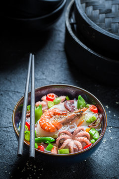 Hot seafood noodle with octopus and shrimps