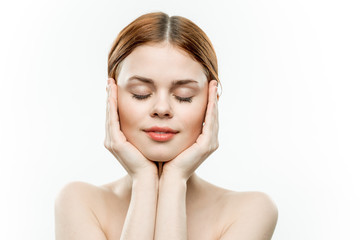 red-haired woman with closed eyes, hands near the chin