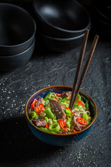 Spicy asian noodle with vegetables and beef