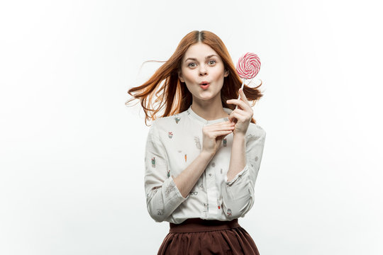 surprise, a woman with a lollipop