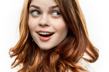 red-haired woman with a surprised expression