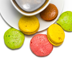 Coffee and colorful macaron on a white background. Isolated