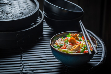 Enjoy your noodle with chicken, vegetables and chili peppers