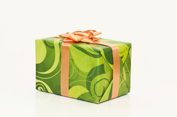 Green closed present box with orange ribbon. Isolated on white background