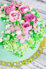 Birthday cake with flowers rose on white background