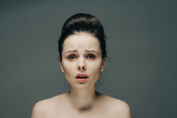 emotional brunette with a bunch on her head