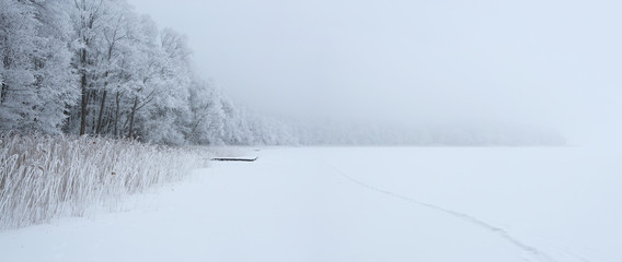 Frozen empty lake during the winter with copy space