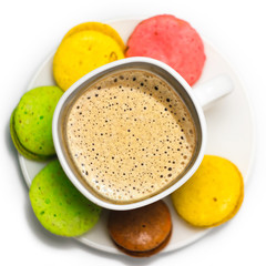 Coffee and colorful macaron on a white background. Isolated