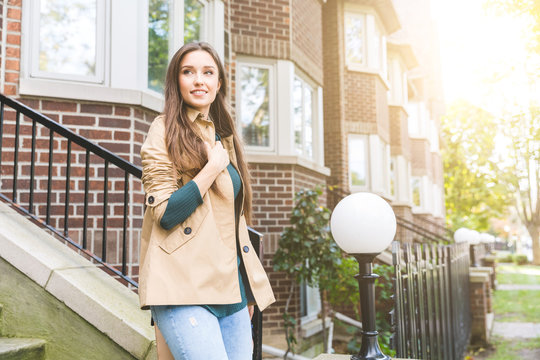 Beautiful Woman Walking Out From Home In Toronto