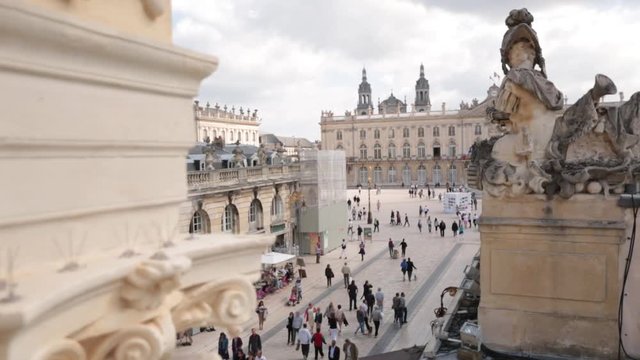 Groups of people on the Place Stanislas seen from the Porte H&eacute;r&eacute;, Nancy, France