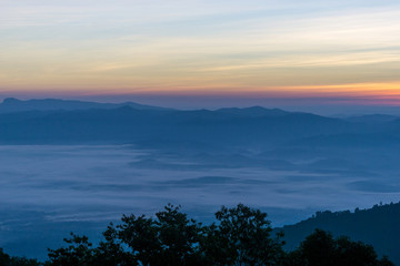 Morning sun and fog on the mountain