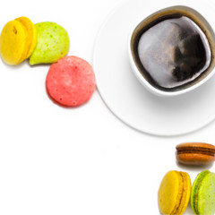 Coffee and colorful macaron on a white background. Isolated
