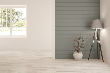 White interior design with lamp and green landscape in window