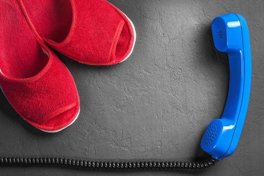 Red slippers with handset on the floor