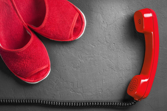Red slippers with handset on the floor