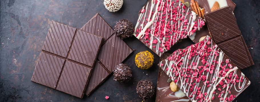 Stack of chocolate bars and praline truffle