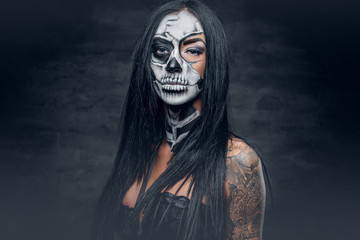 A woman with painted skull face.