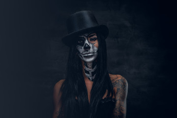A woman with painted skull face.