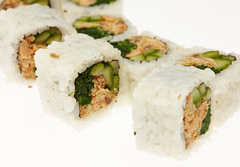 Roll sushi on a plate isolated on white background.