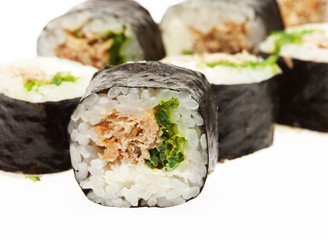 Roll sushi on a plate isolated on white background.