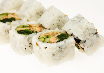 Roll sushi on a plate isolated on white background.