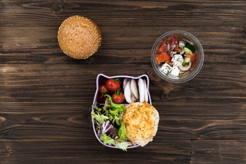 Fototapeta na wymiar Fresh bun standing above lunch box