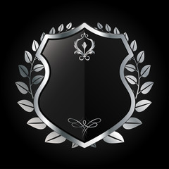 Fototapeta premium vector illustration of black and silver heraldic shield with metal laurel wreath - symbol for security and protection