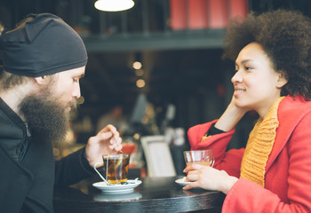 Beautiful couple enjoying tea in a restaurant