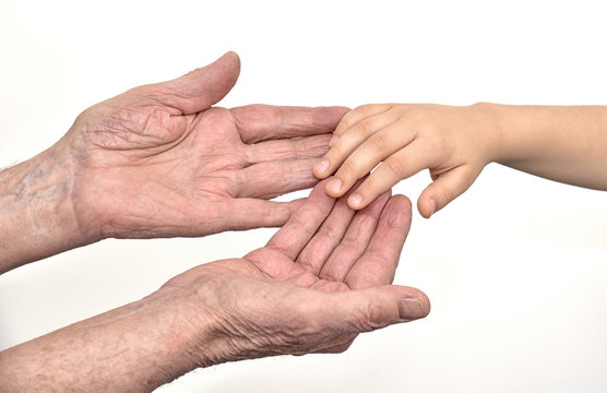 Hands of  old man and child