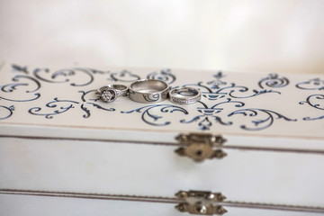Wedding rings on a white vintage box