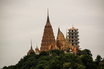Fototapeta premium THAM SUEA Temple Buddha Images architectural style by Chinese arts located Kanchanaburi province Thailand 