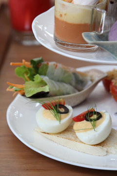 Boiled eggs on white plate.
