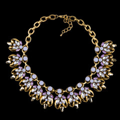 Golden necklace with diamonds  on black background