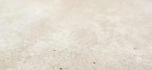 Gray cement background with small inclusions.