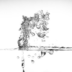 splashing water with bubbles on white background closeup