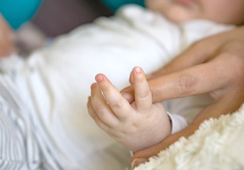 Closeup. Soft focus and blurry of Baby and mother hands, vintage style color effect