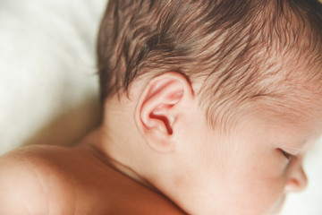 The Part of Head of Newborn Cute Baby.Ear.Detail.Selective Focus