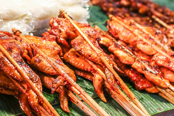 Delicious spicy grilled chicken meat on sticks, Thai food