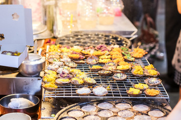 Thai style sweet dessert made of coconut milk and grain cereal topping