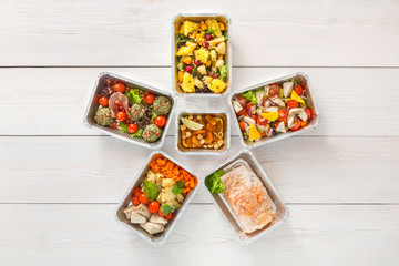 Healthy food take away, top view at wood background